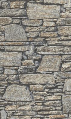 a stone wall that is made out of various types of rocks