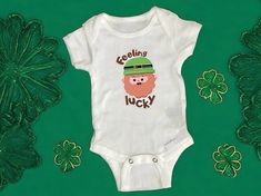 Saint Patrick's Day baby onesie®️| Irish baby apparel | charming baby outfit | cute Saint Patrick's day designs| quirky Irish quotes for babies | shamrock baby clothes | leprechaun themed baby attire |lucky charms baby onesies®️ | green and gold baby outfits Welcome to HappyNestStudio!!  Introducing our adorable Saint Patrick's Day Baby Bodysuit, crafted from 100% soft cotton to ensure utmost comfort for your baby's delicate skin. The non-toxic sublimation ink used guarantees both safety and longevity, ensuring the charming leprechaun design and quote remains vibrant even after multiple washes. Easy to care for, simply toss it in cold water and tumble dry. Please note, avoid ironing and bleaching to preserve the vividness of this delightful outfit. Make your baby's first Saint Patrick's Da Playful Short Sleeve Onesie Gift, Playful Short Sleeve Onesie As A Gift, Playful Short Sleeve Onesie As Gift, Playful White Bodysuit Gift, Playful White Bodysuit As Gift, Playful White Bodysuit As A Gift, Irish Baby, Gold Baby, Baby Quotes