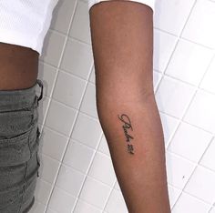 a woman's arm with a tattoo on it that reads, love is in the air