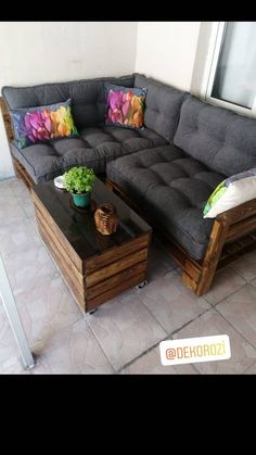 a couch and coffee table on a patio