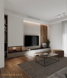 a modern living room with white walls and wood flooring