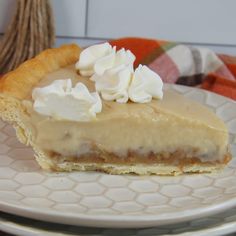 a slice of pie with whipped cream on top