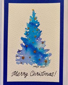 a christmas card with a blue tree on it