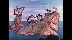 the mermaids are playing music on the rocks by the ocean with harps in their hands