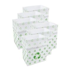 six white boxes with green designs on them