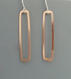 "These hoops are completely made by hand from 14k rose gold filled metal.  The metal is similar is color to copper (but will not tarnish) and has a shiny finish that shimmers in the light. They are very light weight and easy to wear. They measure about 1 1/2\" long.  Rachel Wilder Jewelry is all handmade solely by the artist. I create my designs by hand starting with straight wire which I shape, fuse, hammer and polish or oxidize. With the metal work complete I add natural gemstones and handmade Rectangular Copper Earrings With Ear Wire, Modern Rose Gold Rectangular Jewelry, Rectangular Rose Gold Earrings For A Gift, Nickel-free Rectangular Copper Jewelry, Stylish Jewelry Accessories, Branch Earrings, Prom Accessories, Soldering Jewelry, Wire Work Jewelry