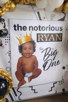 a sign with a baby wearing a crown on it