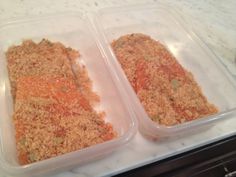 two plastic containers filled with food on top of a counter