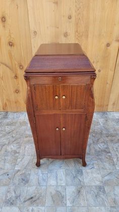 an old wooden cabinet sitting on the floor