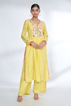 Yellow front gathered kurta with mirror embroidered yoke and sleeves with potli borders. Comes with coordinating palazzo. - Aza Fashions Bohemian Anarkali Set With Dori Work, Yellow Long Sleeve Kurta With Mirror Work, Festival Long Sleeve Palazzo Set With Dori Work, Bohemian Dori Work Kurta For Festive Occasions, Bohemian Salwar Kameez With Dori Work, Bohemian Kurta With Dori Work For Navratri, Bohemian Dori Work Kurta For Navratri, Gopi Vaid, Yellow Mirror