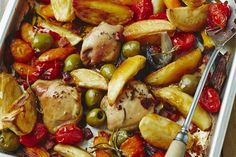 a pan filled with chicken, potatoes and olives