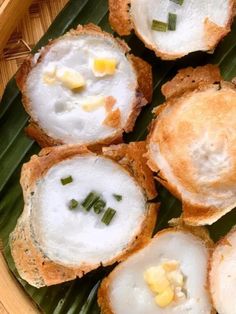 some food is sitting on top of a banana leaf