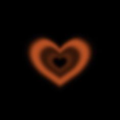 a heart shaped object in the dark with an orange glow on it's side