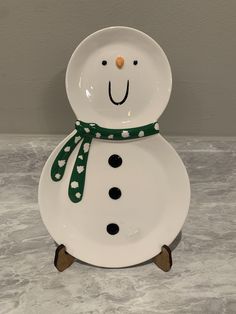 a white plate with a snowman design on it