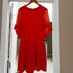 Beautiful Nwt Red Dress With See Through Wing-Like Sleeves Elegant Red Flowy Mini Dress, Red Flowy Midi Dress For Evening, Flowy Red A-line Dress, Flowy Red Knee-length Mini Dress, Elegant Red Dress, Taylor Red, Taylor Dress, Elegant Red, Size 6 Dress