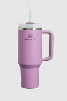 a purple travel mug with a straw sticking out of it