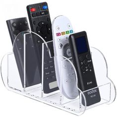 three remote controls are in a clear holder