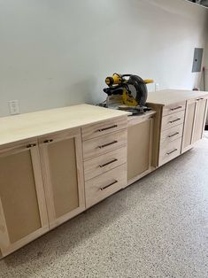 a workbench with drawers and a circular saw