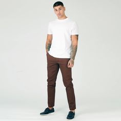 "Looking for a sharp and sophisticated look? Then it would be best if you have a pair of our chocolate brown slim fit chino trousers. These trousers are made from twill fabric, and they have a slim fit that will create a sharp silhouette. They're also stretched for maximum comfort, and they feature a 5-pocket design. Whether you're dressing up for work or heading out for a casual night on the town, these chino trousers are a versatile wardrobe staple. Product Features: Chocolate brown twill fabric Slim fit Stretch Button and zip fly fastening 5-pocket design 98% Cotton, 2% Elastane Our Model is 6'1\" and Wears Size 32, to find the perfect fit for yourself check our Size Guide. Size = 30 - 40 Waist = 79cm - 104cm Hip = 99cm - 106cm Inside Leg = 81cm Waist is measured All Around. Hip is meas Brown Tapered Leg Chinos For Business Casual, Casual Brown Slim Fit Dress Pants, Slim Fit Brown Dress Pants With Tapered Leg, Brown Slim Fit Tapered Leg Pants, Brown Slim Fit Dress Pants With Tapered Leg, Brown Straight Chinos For Business Casual, Fitted Brown Chinos With Tapered Leg, Fitted Brown Tapered Leg Chinos, Brown Slim Fit Dress Pants For Business Casual