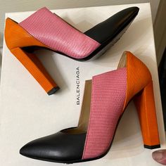 Gorgeous Balenciaga Colorblock Heels! Features Geometric Shape And Colorblock Design Each Color Has A Different Texture!! The Black Is Smooth Lambskin Leather, The Pink Is A Sassy Crocodile Embossed Leather, And The Orange Is A Striped Suede Leather. Very Rare Style And Purchased In London. 4” Heel Size Is Printed As 37, But They Run Smallmore Like A Regular 6 Or Narrow 6.5. Come With Box, Extra Heel Taps, And Dustbag. Heel Taps, Shoes Balenciaga, Color Block Heels, Heel Tap, Different Textures, Lambskin Leather, The Pink, Embossed Leather, Very Rare