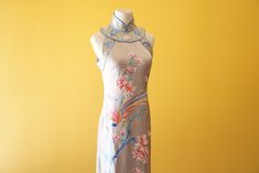 Get all the things you want in this cheongsam dress for your Chinese wedding. Comes with stunning hand embroidery of both the phoenix and peacock symbols--traditionally found on a Chinese wedding dress. This dress can be customized to your measurements as well as length. Have another design in mind? We also do bespoke designs based on your preferences and style--please check out www.eastmeetsdress.com. ✨Check out our additional dresses at www.eastmeetsdress.com✨ The Details: * Silk fabric * Beau Ceremonial Fitted Dress With Floral Embroidery, Ceremonial Fitted Floral Embroidery Dress, Ceremonial Silk Fitted Dresses, Traditional Fitted Sleeveless Cheongsam, Spring Ceremonial Fitted Dress, Chinese Bridal Dress, Modern Chinese Wedding Dress, White Cheongsam, Modern Chinese Wedding