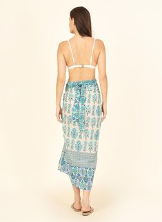 Meet Arlo, the ultimate beach piece that you should never leave home without. Its extended banded waist strap allows you to turn it into a wrap skirt, tie it open on the side or tie it around your neck to become a halter dress. The possibilities are endless (unlike your vacations days). Item Details: 100% Cotton Voile Machine wash, line dry Fit Details: One size Length: 42" Width: 49" Model is 5' 8", size 2 Beach Swimwear With Knotted Straps And Tie-side Bottom, Summer Swimwear With Wrap-around Straps For Vacation, Sleeveless Swimwear With Wrap-around Straps For Vacation, Bohemian Tie-side Sarong For Vacation, Bohemian Wrap Swimwear For Vacation, Bohemian Wrap Sarong For Vacation, Bohemian Wrap Beach Cover-up Swimwear, Sleeveless Swimwear With Tie Straps For Beach, Beachwear Wrap Cover-up With Tie Waist