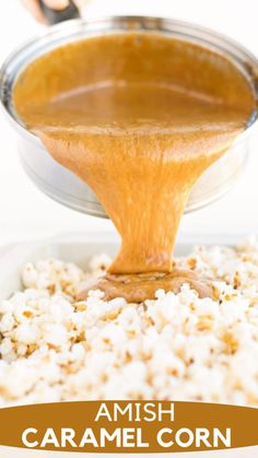 caramel sauce being poured over rice in a bowl with the words amish caramel corn on it