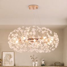 a chandelier hanging from the ceiling in a living room