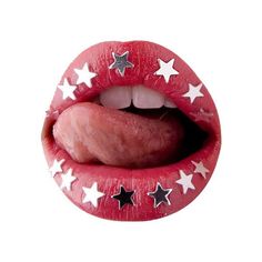 a close up of a person's tongue with stars on it