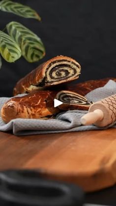 a wooden cutting board topped with sliced food