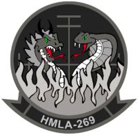 an emblem with two snakes on it and the words hmla - 209 written below