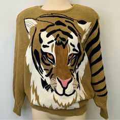 Gorgeous One Of A Kind 80s Novelty Sweater By Bonnie Boerer & Company 1986 Cotton Ramie Khaki Tan Light Brown Thick Knit Tiger Big Cat Print Animal Printed Tiger Striped Sleeve Novelty Appliqu Padded Shoulders Ribbed Knit Cuffs & Hem Batwing Sleeve Long Sleeves Ribbed Bottom Width: 14” Length:30” Size Small Love This Look? More Unique Designer Vintage Items Available... Listing New Items Daily! 1980s Luxury Designer Retro Chunky Fall Office Halloween Costume Office Halloween Costumes, Office Halloween, Novelty Sweater, Designer Sweater, Tiger Stripes, Designer Vintage, Big Cat, Striped Sleeve, Tiger Print