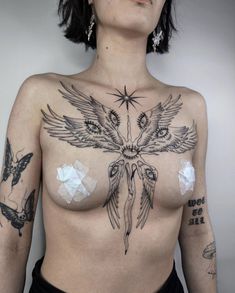 a woman with tattoos on her chest