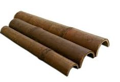 three rolls of brown paper on a white background