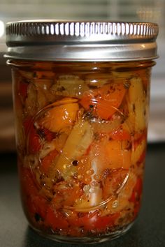 a glass jar filled with food sitting on top of a counter