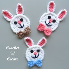 three crocheted rabbits with bows on their ears, one wearing a bow tie