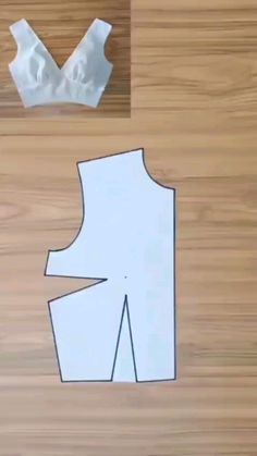 the paper is cut out to look like an origami man's torso