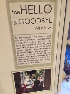 there is a sign that says the hello and goodbye window with pictures of people in it