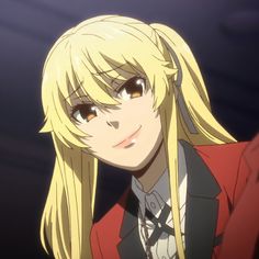 a blonde haired woman with long hair and bangs in a red jacket looking at the camera