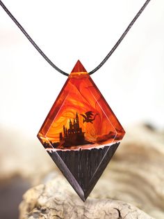 🐉 Dragon Castle Wood Resin Necklace - A Personalized Fantasy Gift for Him! 🏰🔥 🌟 Handcrafted with love, this unique pendant is a perfect personalized gift for your boyfriend, especially if he's a DnD enthusiast or a devoted geek. 🎲✨ Personalize the pendant for a truly special touch, making it an ideal gift for Christmas or any occasion. 🎁 Perfect Christmas Gift: Surprise your loved one with a one-of-a-kind castle necklace, embracing the spirit of the season with this enchanting and festive accessory. 🌲 Wood Resin Jewelry: Indulge in the fairytale with this wood resin jewelry, a blend of natural elements and fantastical design that's perfect for any fantasy lover. 🔮 Explore the Faire Element: Immerse yourself in the magical allure of our Dragon Castle Necklace, where the faire elemen Dnd Gift Ideas, Dnd Necklace, Tomboy Things, Dragon Castle, Dnd Gift, Dungeon Master Gifts, Star Wars Jewelry, Wood Resin Necklace, Wood Resin Jewelry