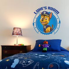 the paw patrol bedroom is decorated in blue and features an image of luke's room