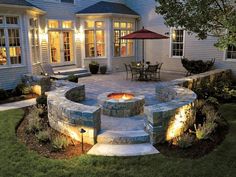 an outdoor fire pit surrounded by lawn furniture