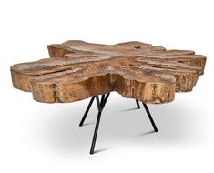 the table is made out of wood and has black metal legs, with an intricate design on