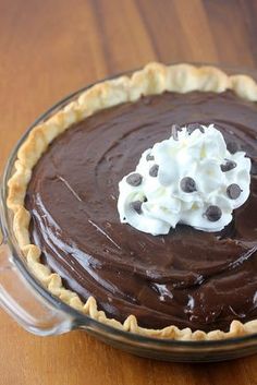 a chocolate pie with whipped cream on top