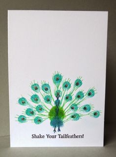 a card with a peacock on it and the words shake your tailfeather