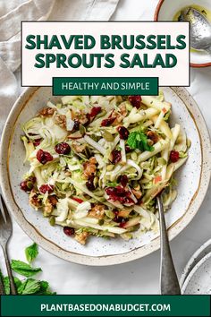 shaved brussels sprouts salad with cranberries and walnuts in a bowl