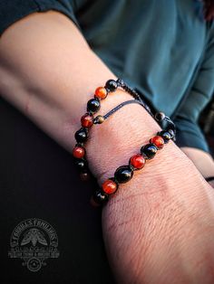 6mm Carnelian & Black Obsidian gemstone beads on black Brazilian waxed cord.  Carnelian promotes creativity, confidence, and empowerment. Black Obsidian is a grounding stone, protects from negative energy & soothes the mind. It can also be used to promote self control. Macrame style knot. Bracelet has adjustable slide knot. Handmade Black Obsidian Beaded Bracelets, Adjustable Black Spiritual Beaded Bracelets, Black Carnelian Jewelry For Gifts, Black Round Bracelets With Sliding Knot, Adjustable Black Obsidian Beaded Bracelets, Black Adjustable Beaded Bracelets For Healing, Black Carnelian Jewelry With Natural Stones, Adjustable Black Agate Beaded Bracelet, Black Agate Beaded Bracelet Gift