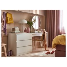 a white dresser sitting in front of a mirror