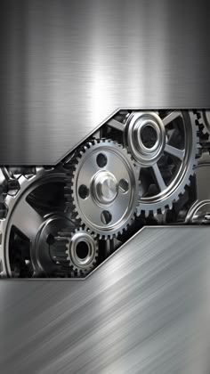 an abstract metal background with two gears in the center and one on the other side