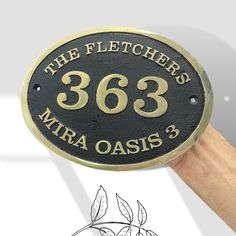 a hand holding a plaque that says the fleeters'863 mira oasis 3